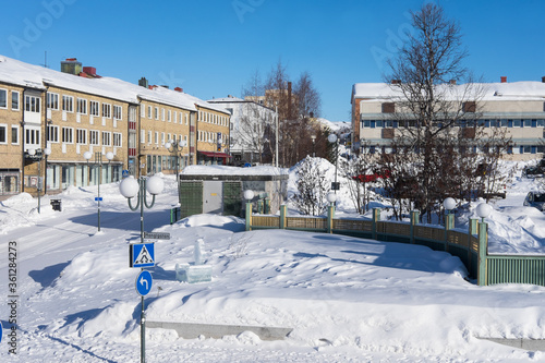 View of the center with shops and houses in winter in Kiruna, Lapland, Sweden. The city will be partially demolished and rebuilt two miles away photo