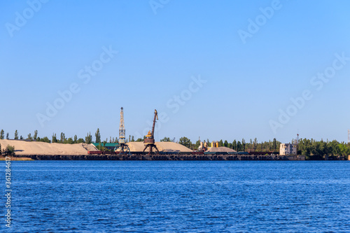 Hoisting cranes at cargo port on the Dnieper river in Kremenchug  Ukraine