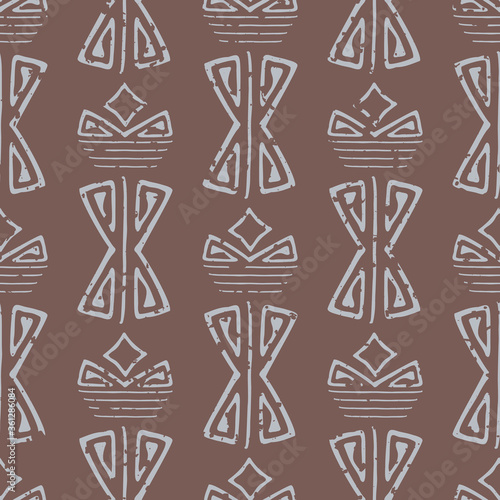 Abstract aztec seamless vector pattern background. Brown backdrop of light blue faded hand drawn shapes.With grunge texture for an aged look. Geometric ethnic repeat for environment friendly packaging