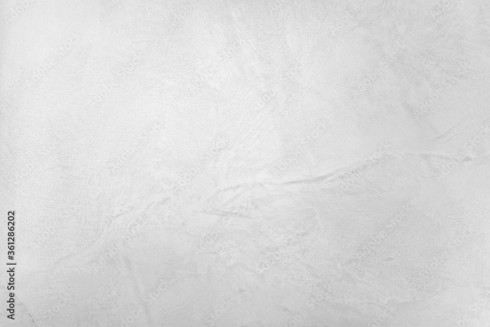 Neutral white colored low contrast Concrete textured background with roughness and irregularities to your concept or product