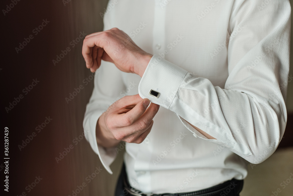 groom in a white shirt, man buttoning cufflink, White shirt