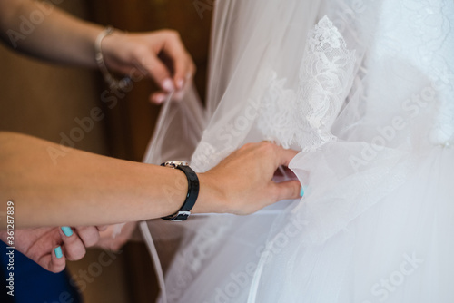 bride in wedding dress, gathering the bride