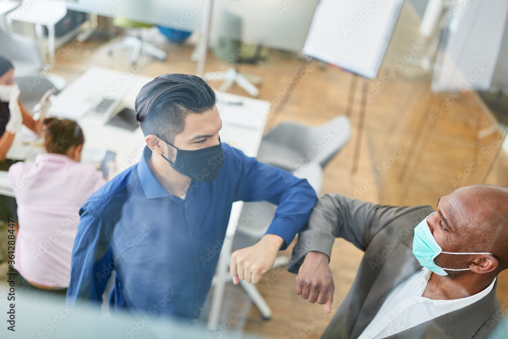 Business people keep distance because of Covid-19 in the office Business people keep distance because of Covid-19 in the office
