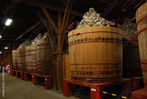 Bild auf Leinwand MISO barrel in MISO(soybeans) warehouse / 味噌蔵の内部と味噌樽