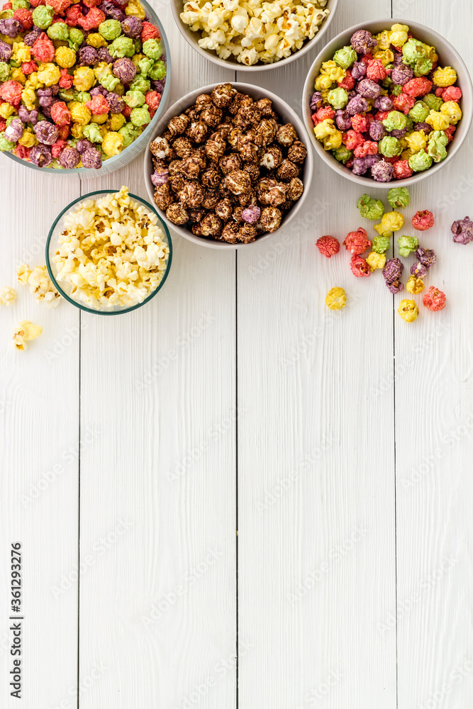 Flavored popcorn on white background top view space for text Flavored popcorn on white background top view space for text
