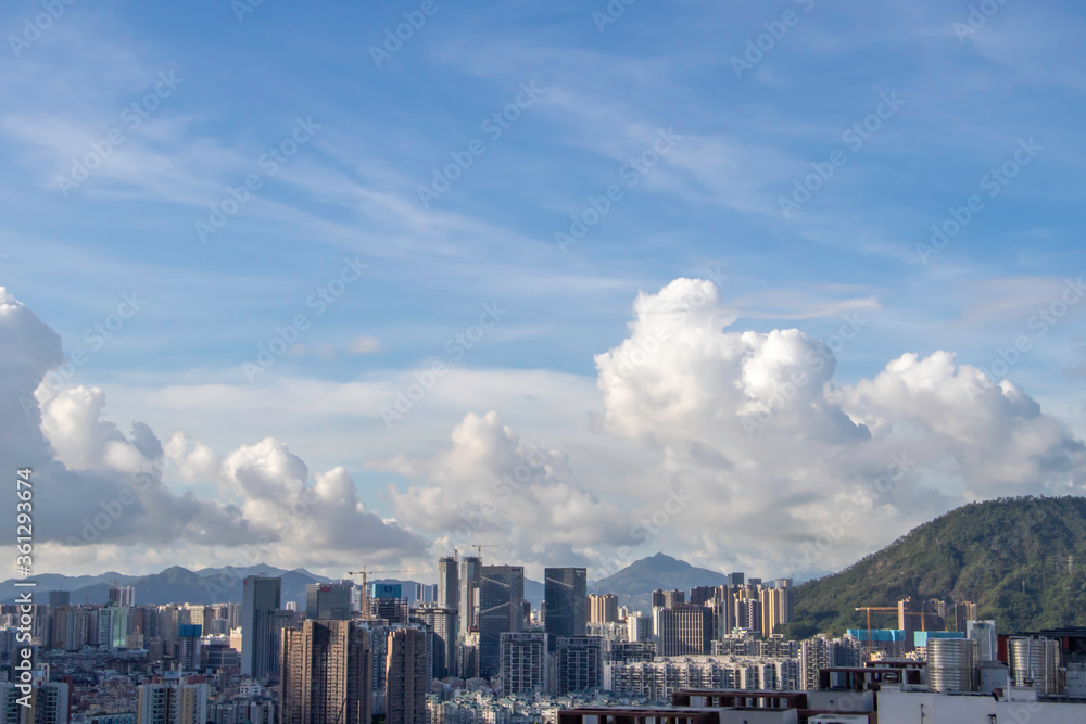 timelapse of clouds over city