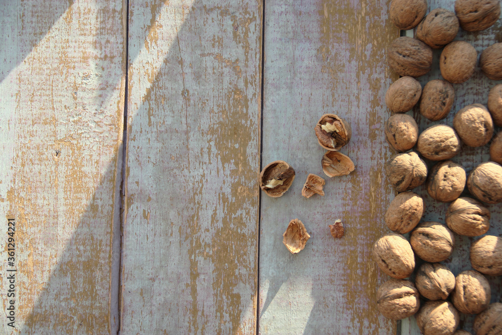 Fresh walnuts on a wooden background Fresh walnuts on a wooden background