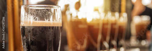 Close up of a glass of stout beer in a bar