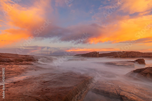 Beautiful sunset over Boat Harbour, rock shelf. Port Stephens, Hunter Region of N.S.W. Australia.