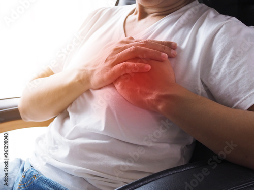 asian young woman with chest pain from heart disease and acute heart attack