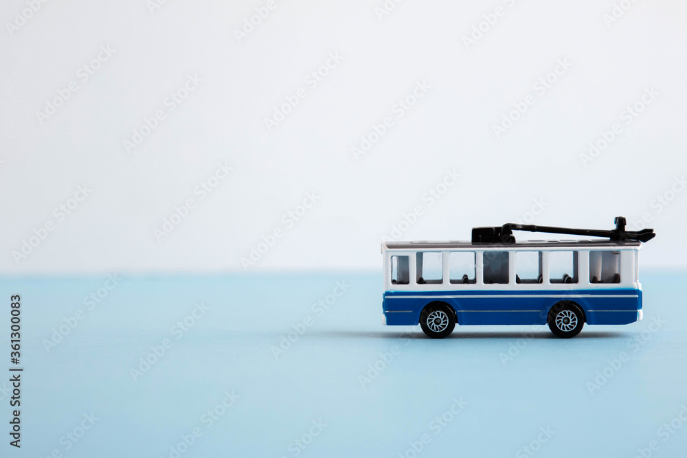 small toy blue and white trolley, place for text 1