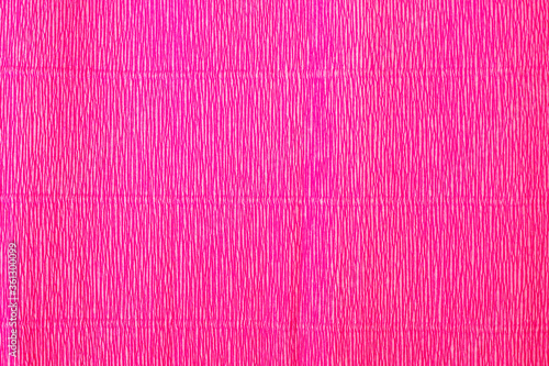 The texture of the corrugated paper. Gift wrapping paper. Pink holiday paper.