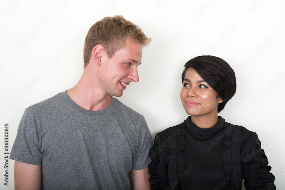 Portrait of young multi ethnic couple together Portrait of young multi ethnic couple together