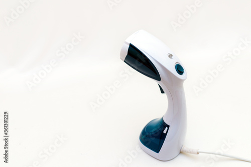 vapor device hot steam generator for dress in dry-cleaning white background .