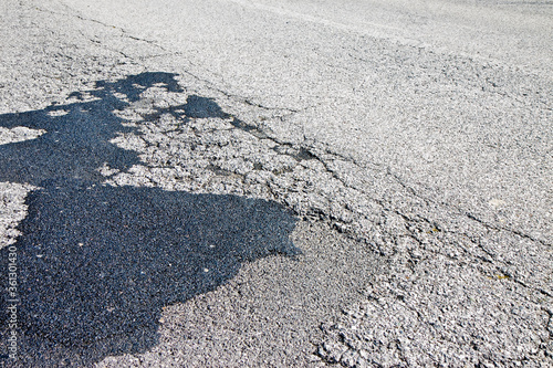 Old damaged asphalt road background