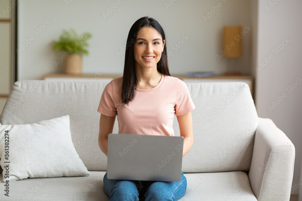 Happy Woman With Laptop Computer Sitting On Sofa Working Indoors Happy Woman With Laptop Computer Sitting On Sofa Working Indoors