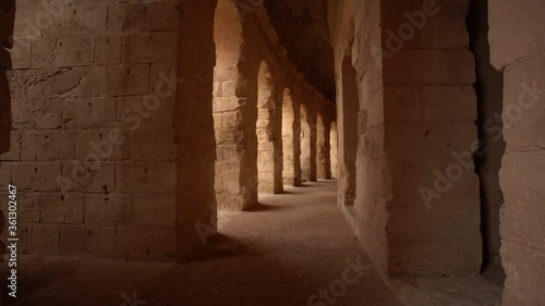Old antique amazing well conserved huge stony walls of ancient Amphitheatre. Walking along ancient beautiful corridors.