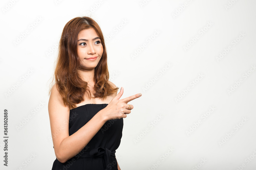 Portrait of young beautiful Asian woman pointing finger Portrait of young beautiful Asian woman pointing finger