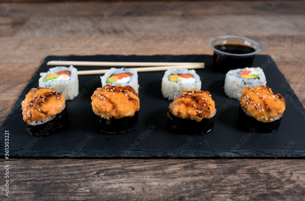 Sushi roll set on the black plate. Japanese food. Sushi roll set on the black plate. Japanese food.