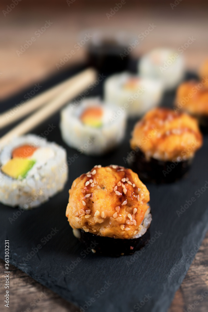 Sushi roll set on the black plate. Japanese food. Sushi roll set on the black plate. Japanese food.