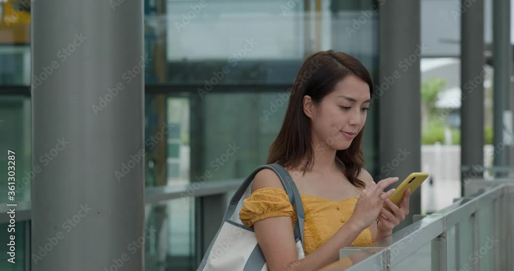 Woman use of mobile phone in city Woman use of mobile phone in city