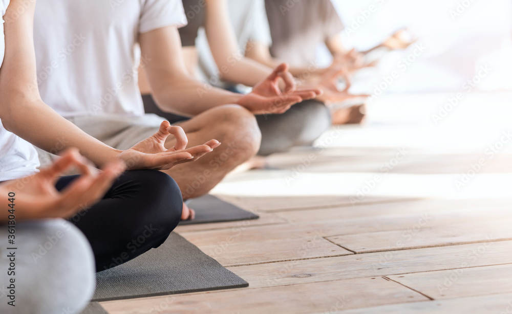 Zen And Meditation. Group Of People Meditating Together In Lotus Position, Cropped