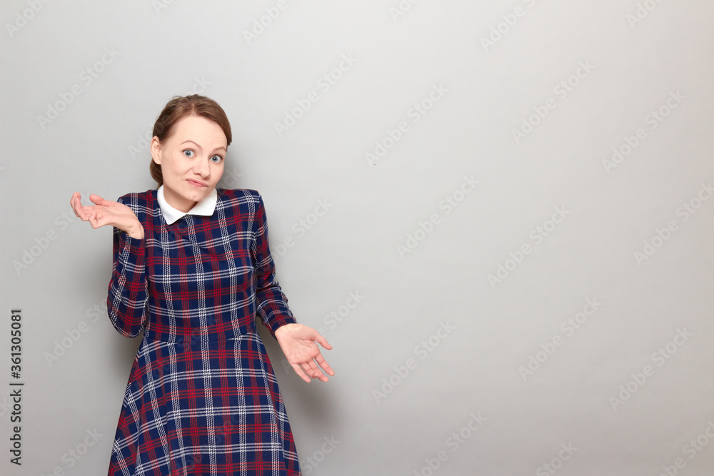 Portrait of funny confused girl waving hands and shrugging shoulders Portrait of funny confused girl waving hands and shrugging shoulders