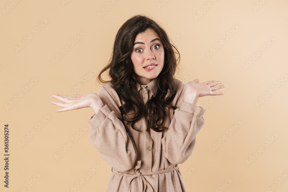 Image of confused cute woman posing with throwing up hands on camera Image of confused cute woman posing with throwing up hands on camera