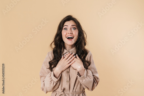 Image of excited beautiful woman expressing surprise on camera