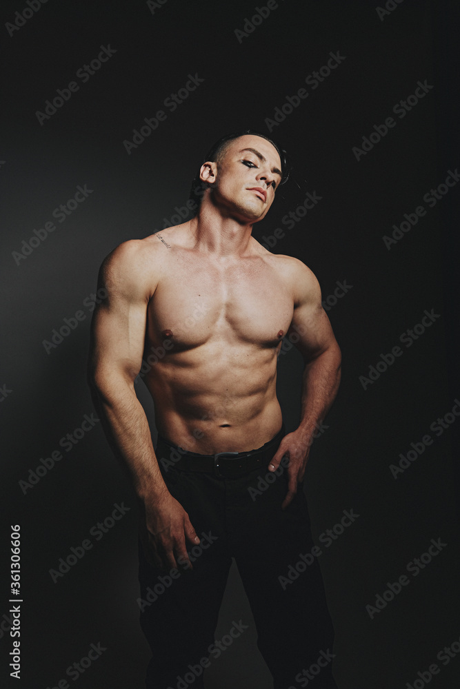 Fototapeta premium A man with raised muscles and a naked torso