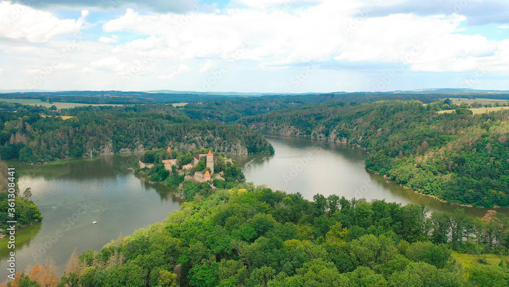 Obraz premium Aerial view on czech medieval castle Zvikov, situated on rocky outcrop above the confluence of two rivers Vltava and Otava, Czech republic