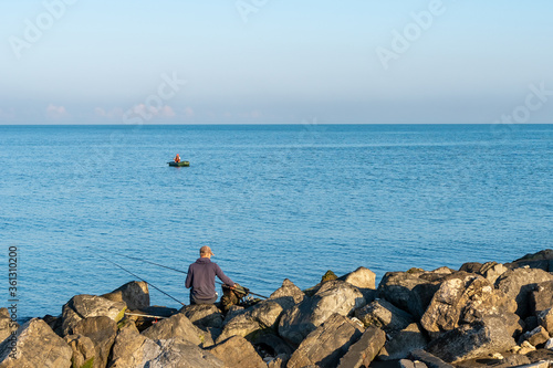 Black Sea coast in the city of Poti, fisherman in the boat © k_samurkas