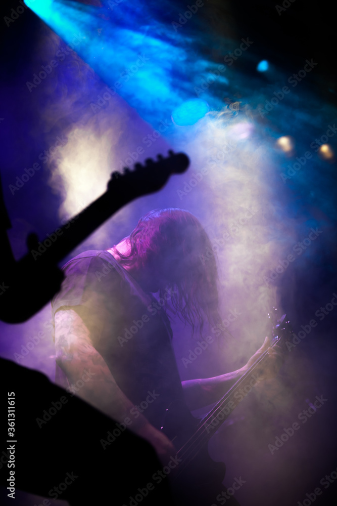 Metal musician in the fogged stage