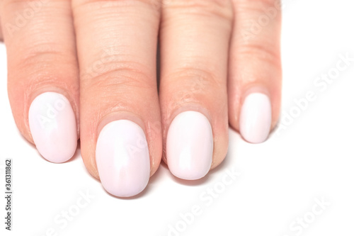 Female hand and overgrown false nails on a white background. Nails care concept.
