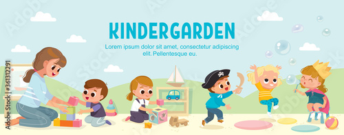 Kids play together in kindergarden. Playroom with children. Babysitting.