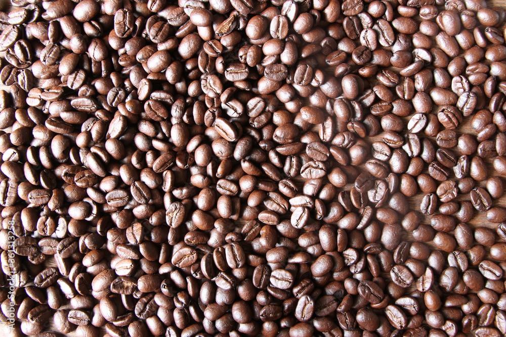 Coffee beans backgound on wooden table Coffee beans backgound on wooden table