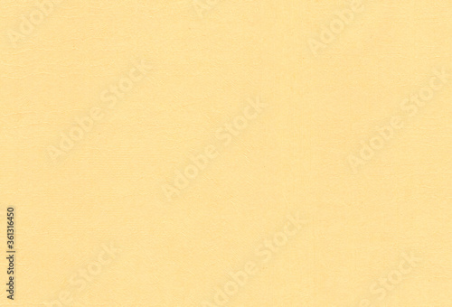 Textured pale orange coloured creative paper background. Extra large highly detailed image.