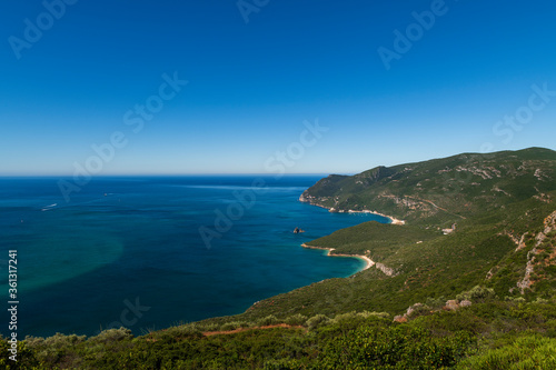 Scenic view of a bay with boats at the Arrabida Natural Park near Setubal, Portugal; Concept for summer vacations and travel in Portugal