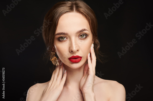 High Fashion Model Girl Portrait with Trendy Hair style and Makeup. Long Black Hairstyle, Black Hair and Red Matte Lipstick. Woman Makeup. Sexy Lips. Haircut