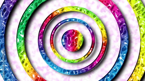 Rotating rainbow rings metallic special effect on a soft pink and white background seamless loop
