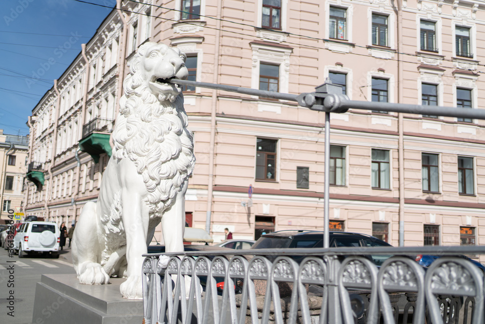 Lion statue in the city on the bridge in St. Petersburg.