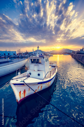 Old fishing boat in port of Naousa on sunset. Paros lsland  Greece