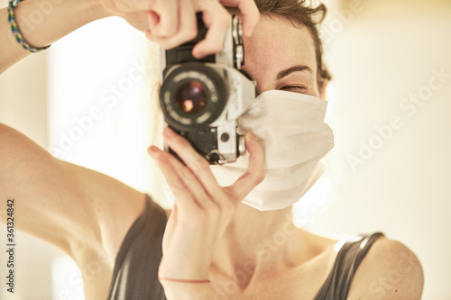 coronavirus mask and a female photographer