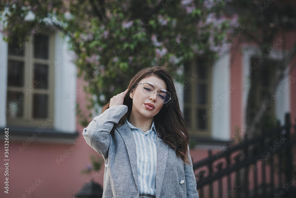 Fototapeta premium Stylish woman posing on the street