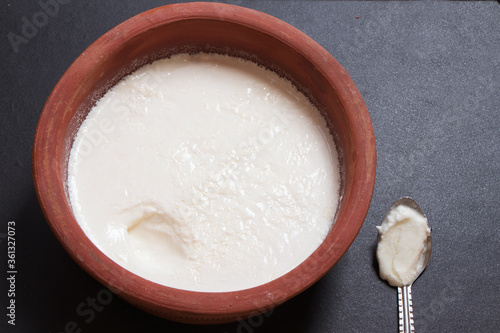 Home made curd in a earthen bowl photo
