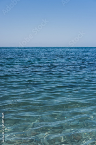 Clear sea water, and rocks on the bottom. Black sea with blue and emerald green water.