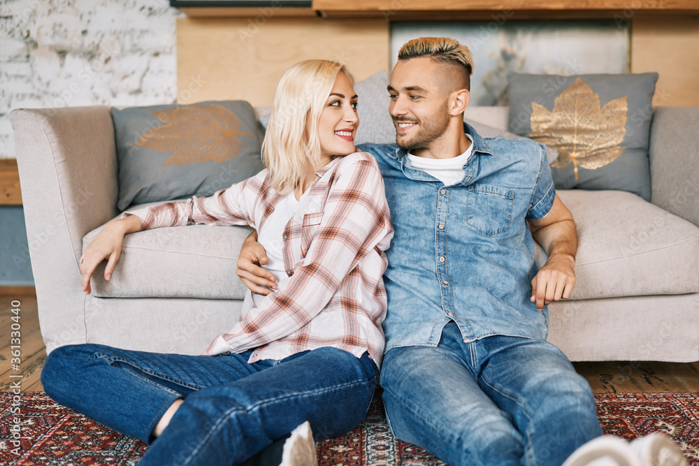Young happy couple portrait relax and hugging at home Young happy couple portrait relax and hugging at home