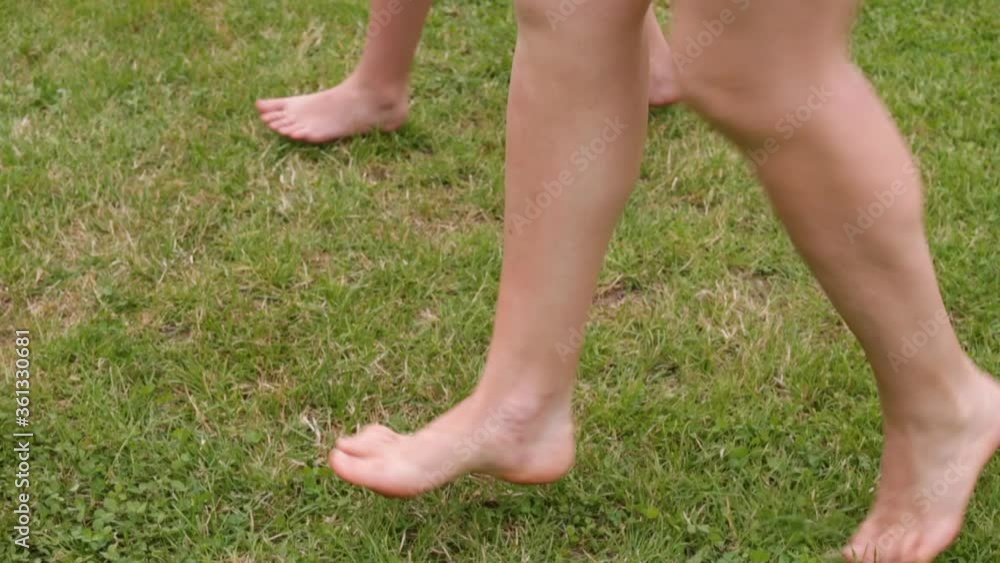 Dance movements of legs on the grass. Learning the technique of jumping dance before the competition. Leg coordination training.