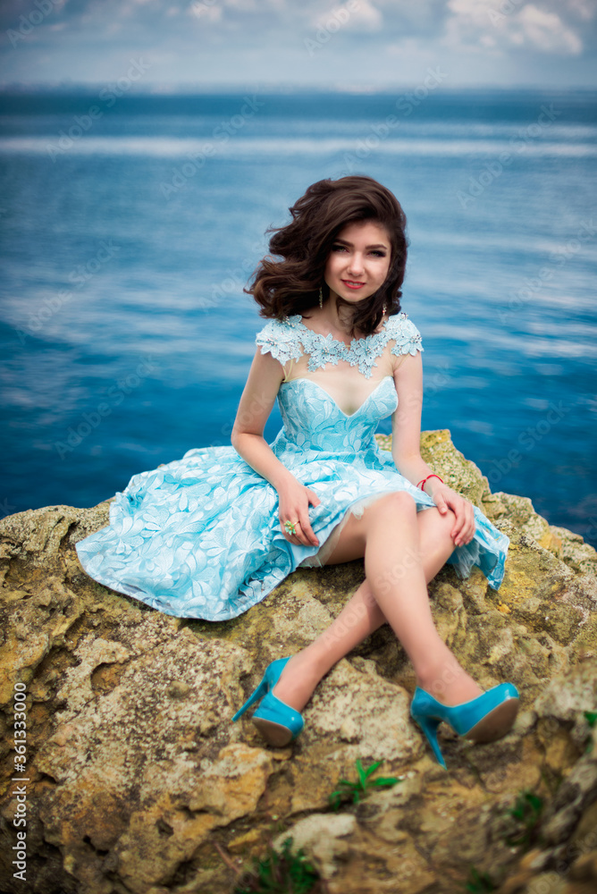 Beautiful young girl in a dress with butterflies on the beach. Portrait Beautiful young girl in a dress with butterflies on the beach. Portrait