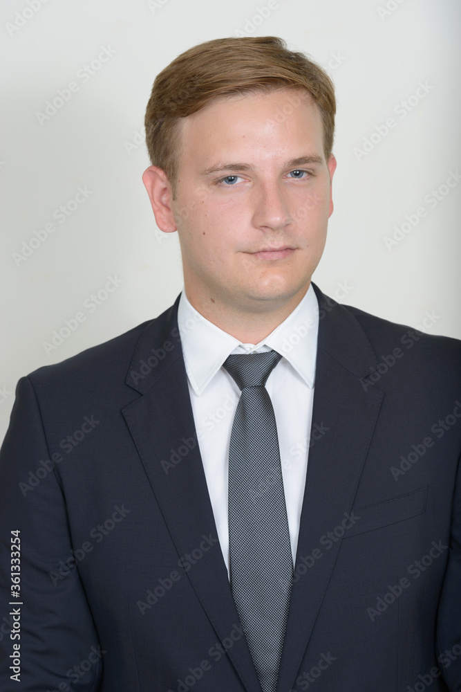 Portrait of businessman with blond hair wearing suit Portrait of businessman with blond hair wearing suit